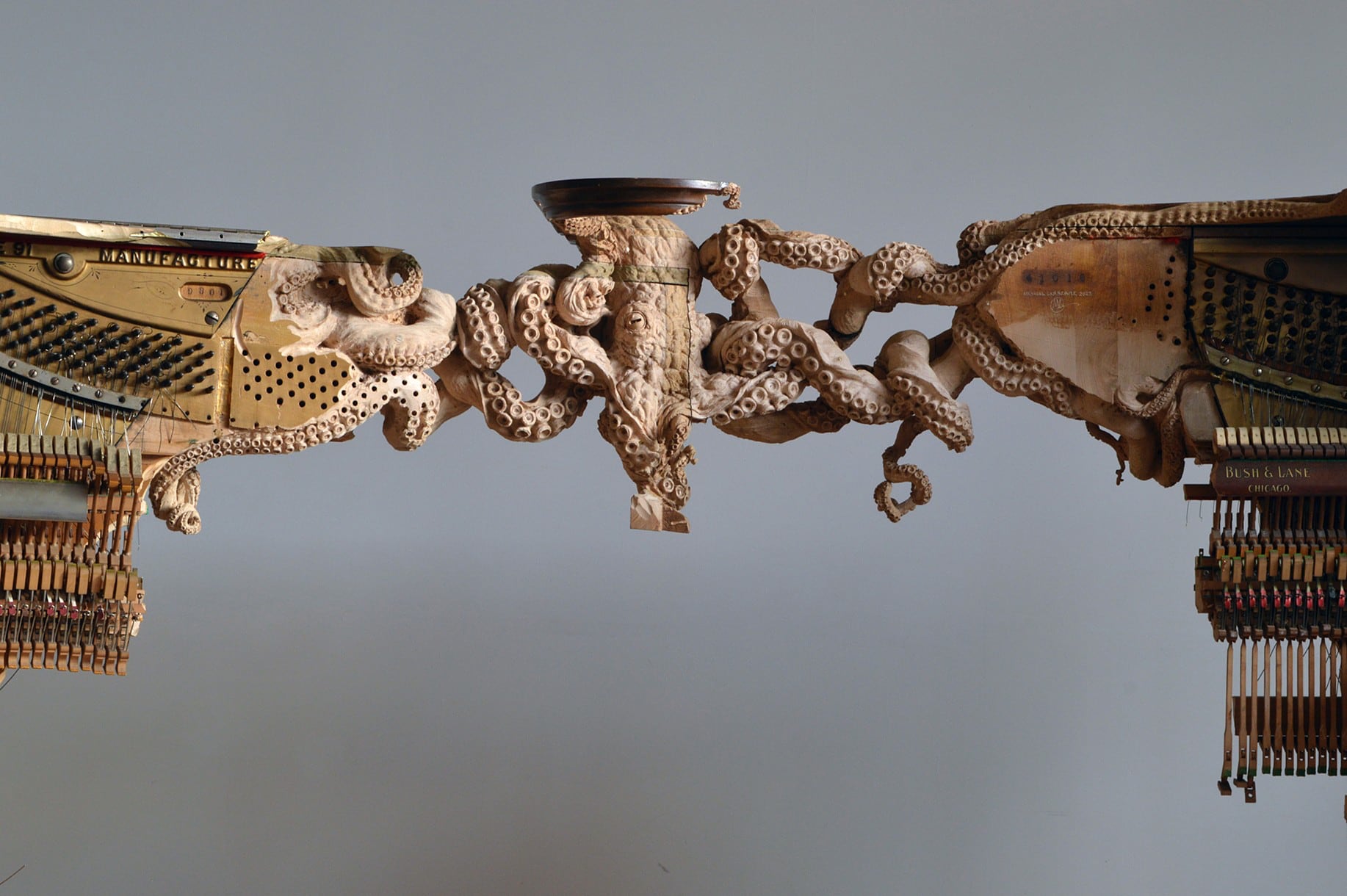 A Knotted Octopus Carved Directly into Two Pianos Entwines Maskull